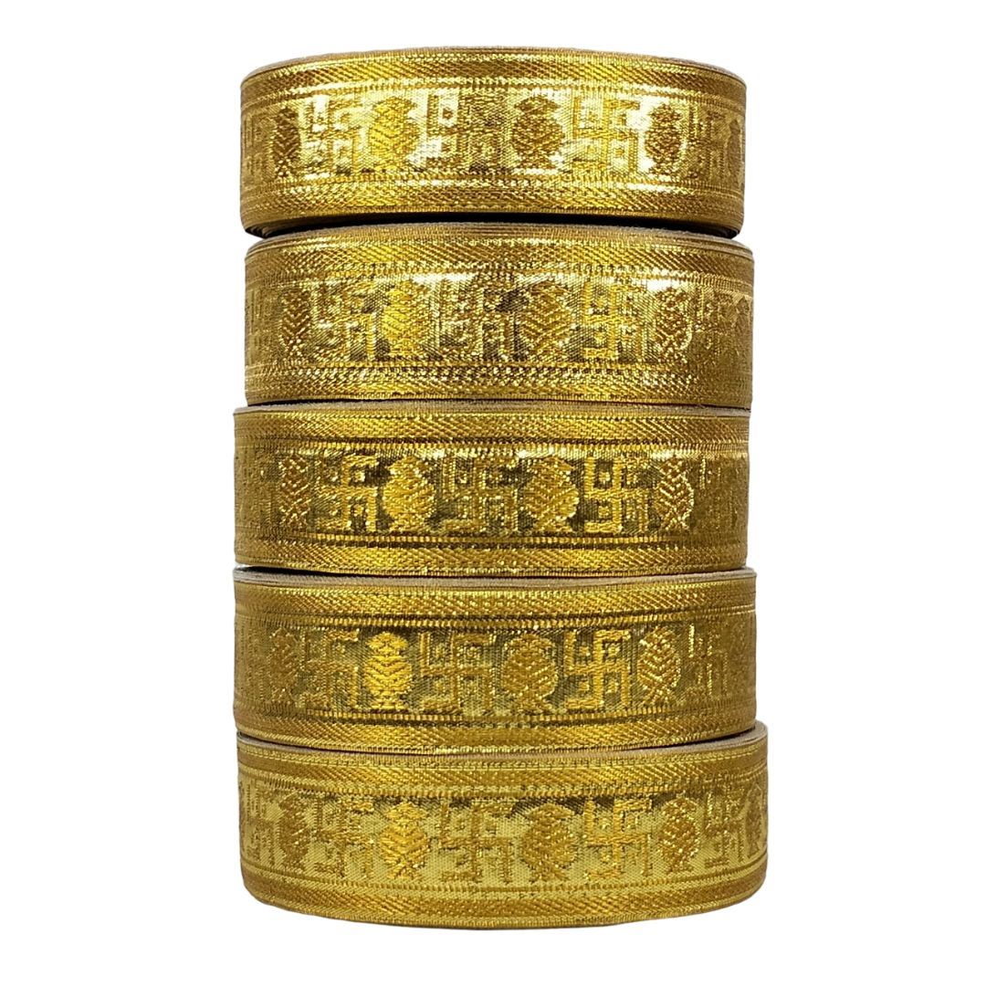 Stack of gold bangles with intricate patterns on a white background
